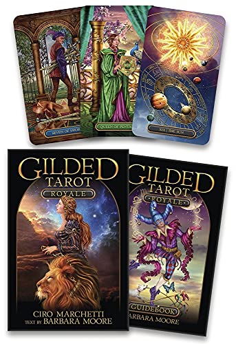 Tarot card deck and guidebook with ornate, colorful illustrations.