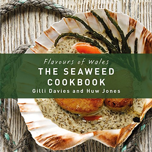 Cookbook cover featuring seafood on a scallop shell with seaweed garnish.