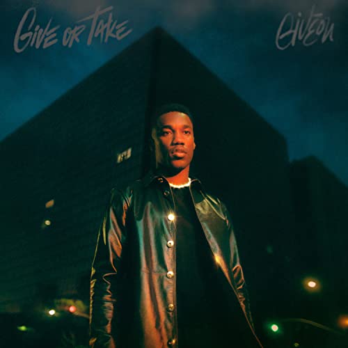 Giveon album cover: portrait of a man in front of buildings.
