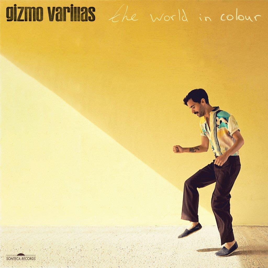 CD cover: man in a colorful shirt walking on a yellow background.