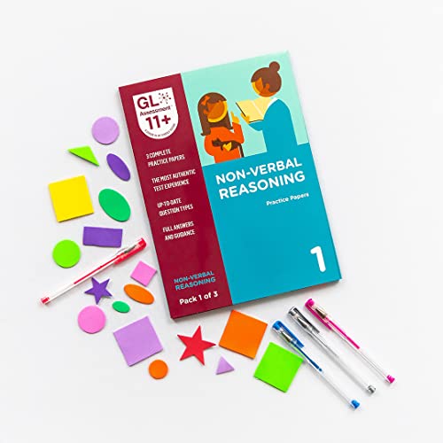 11+ non-verbal reasoning practice papers with colorful geometric shapes and pens.