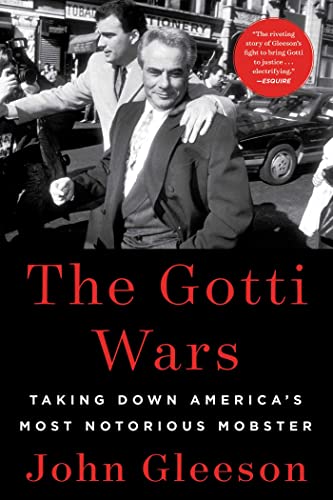 Book cover featuring John Gotti in a suit, surrounded by photographers.
