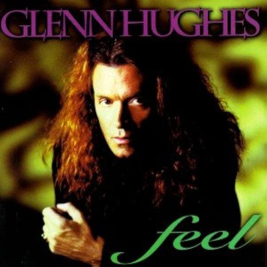 Album cover featuring Glenn Hughes with long hair against a green and black background.