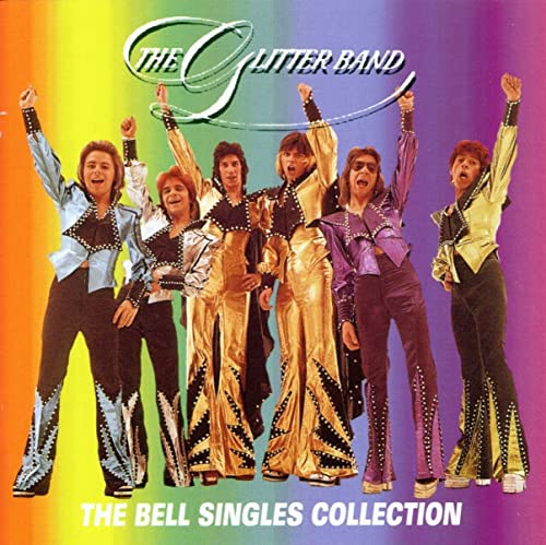 The Glitter Band standing in colorful stage outfits against a rainbow gradient background.