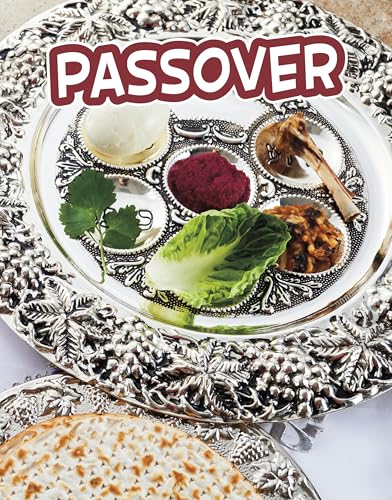 Silver Seder plate with symbolic foods and matzah in foreground.