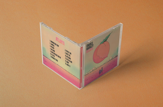Open CD case for Gnarls Barkley Atlanta showing tracklist and peach illustration on cover.