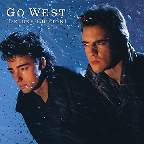 CD cover featuring two men with dark hair against a blue, speckled background.