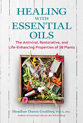 Book cover featuring essential oils, plants, and glass bottles on wood.