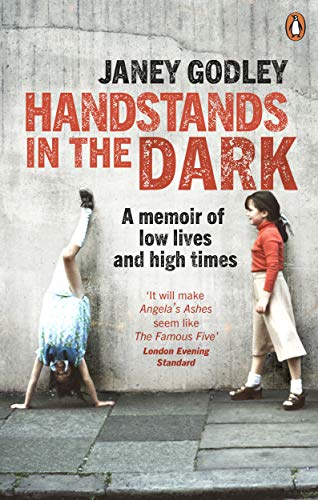 Book cover: two young girls, one doing a handstand against a wall.