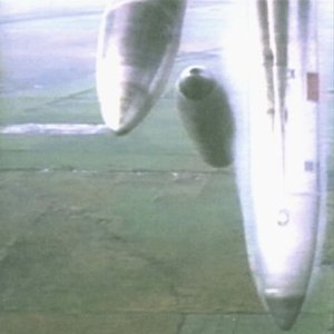 Bombs suspended beneath an aircraft, viewed from below.