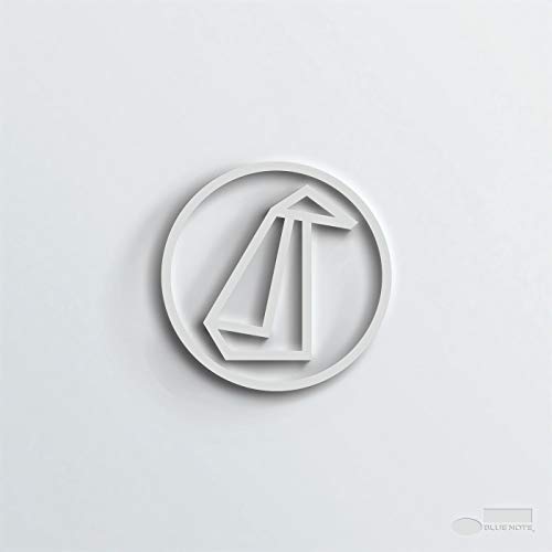 White album cover with an abstract, embossed penguin-shaped design.
