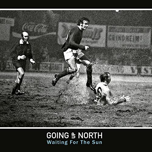 Black and white photo of footballers in action, album title below.