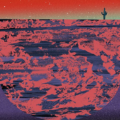 Desert landscape with a cactus under a red and purple sky.
