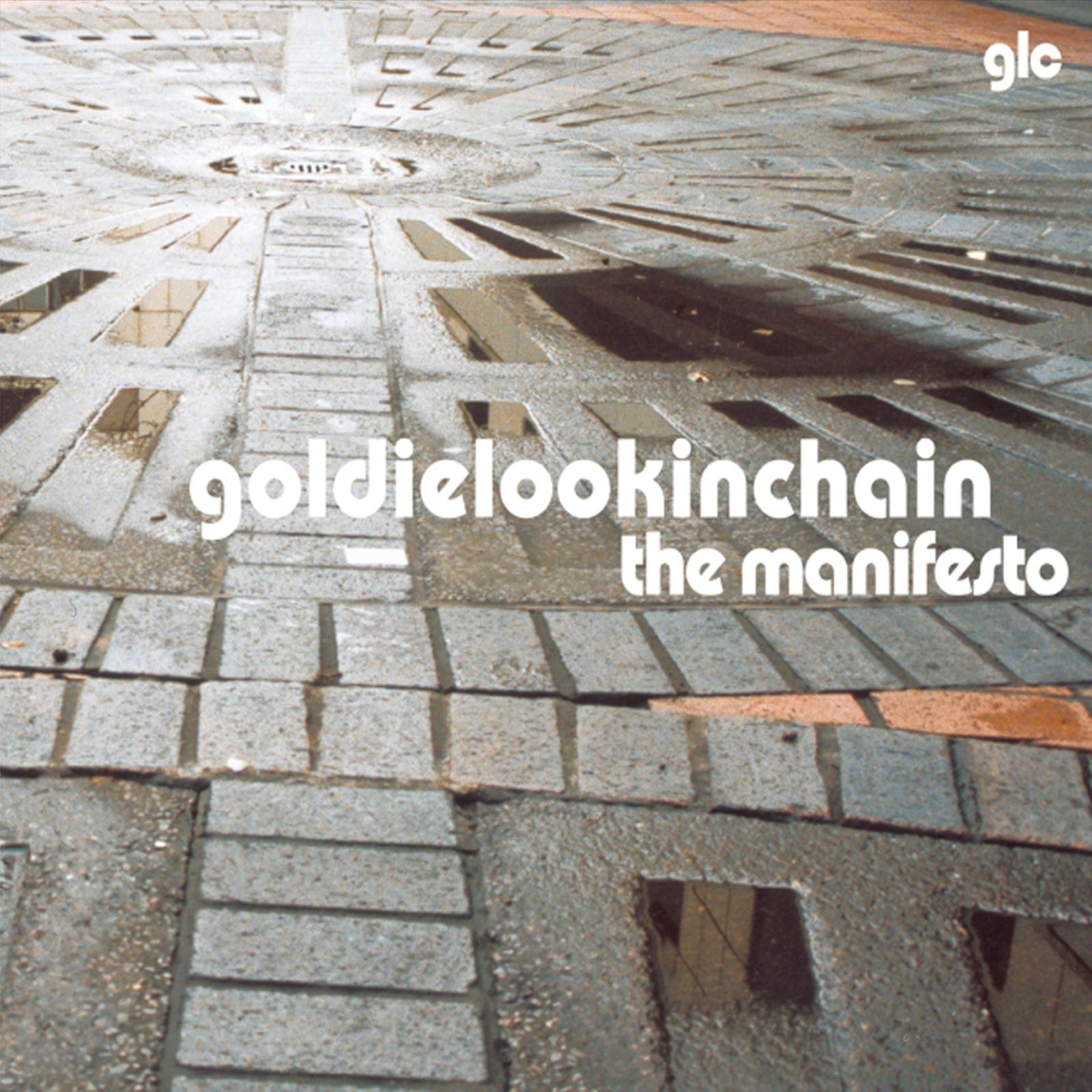 Vinyl album cover featuring a patterned stone plaza with text Goldie Lookin Chain The Manifesto.