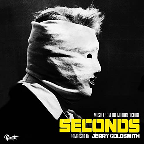 Black and white album cover for “Seconds” with a bandaged face.