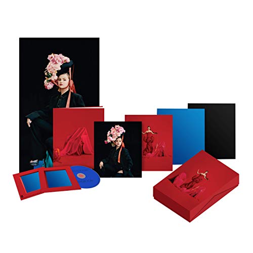 Selena Gomez CD collection with red and blue packaging, floral imagery.