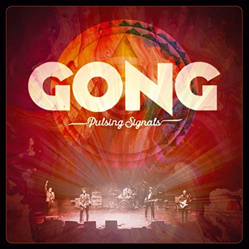Album cover showing a band performing on stage under a large, abstract circular graphic.