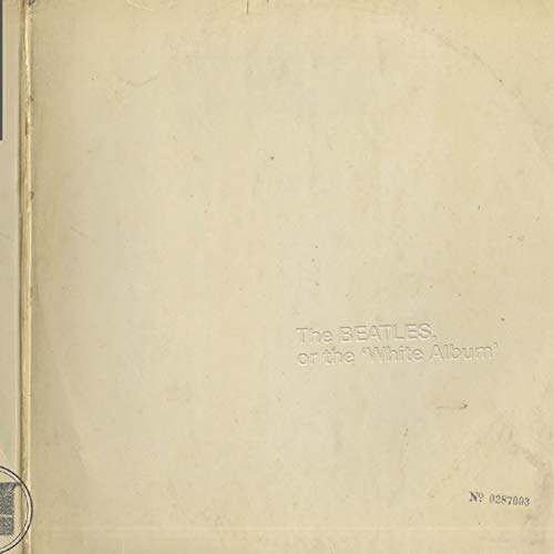 Close-up of The Beatles’ “White Album” cover, embossed text on white.