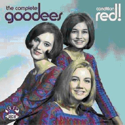 CD cover featuring three smiling women in patterned shirts.