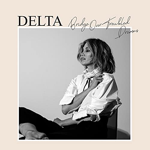 Black and white album cover featuring Delta Goodrem in a white shirt.