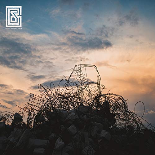 Album cover featuring a pile of twisted metal wire against a cloudy sky.