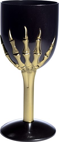 Black wine glass with gold skeleton hand and three stacked skulls on the stem.