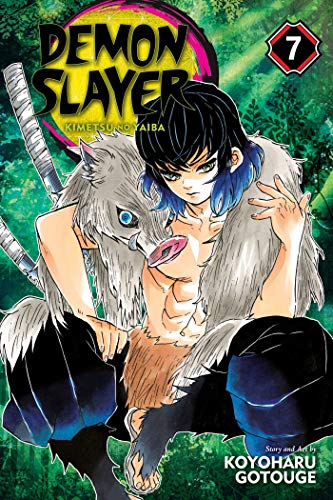 Manga cover featuring Inosuke Hashibira wearing a boar mask over his shoulders in forest.