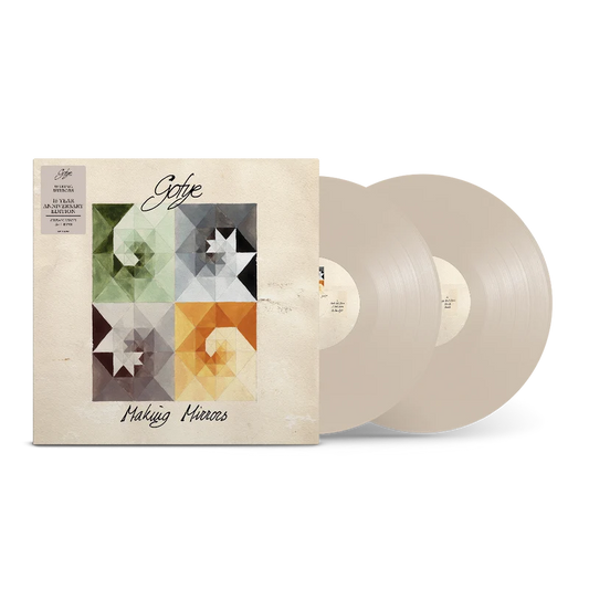 Gotye's "Making Mirrors" 15th anniversary vinyl record with geometric design.