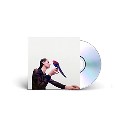 CD case with a woman and a colorful bird, silver disc beside.
