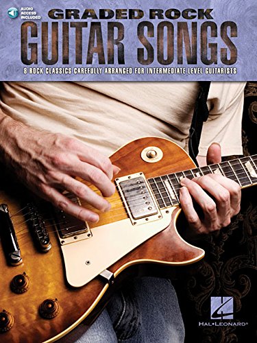 Guitar songbook with a sunburst electric guitar and hands playing.