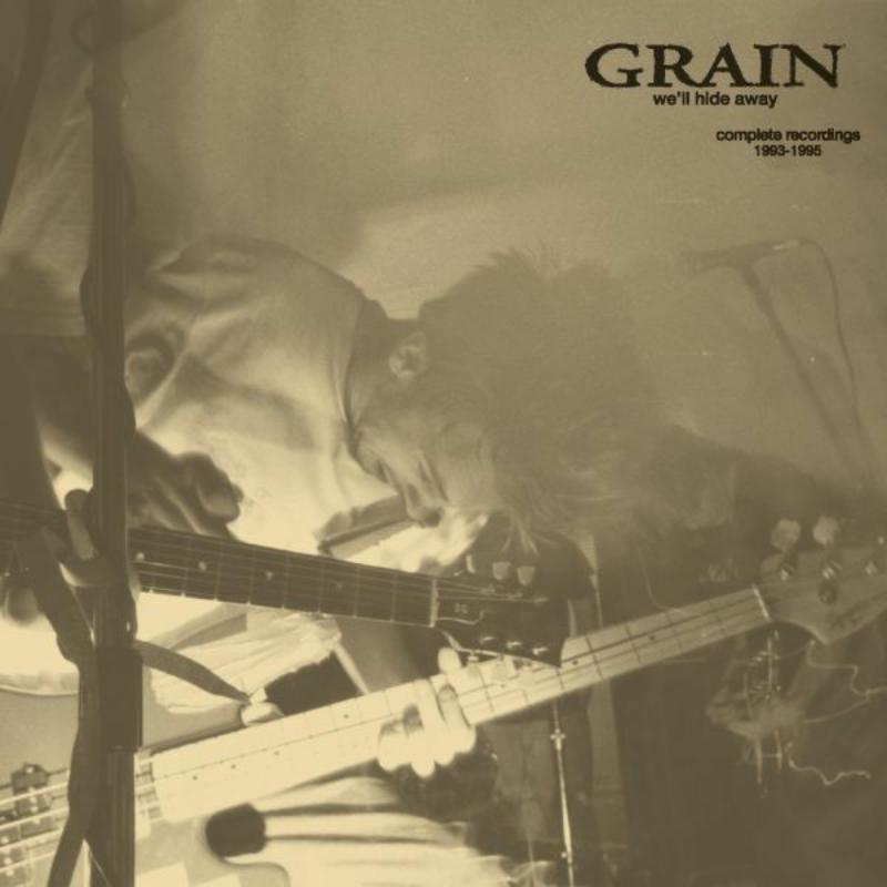 Sepia-toned album cover featuring a musician playing an electric guitar.
