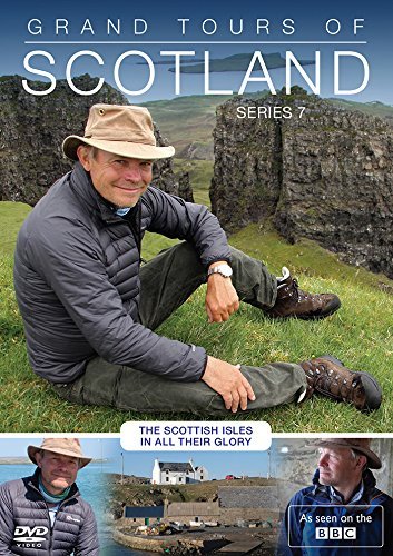 A man in a hat sits on a grassy hill in this DVD cover.
