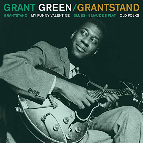 Grant Green album cover: guitarist with guitar, dark green background.