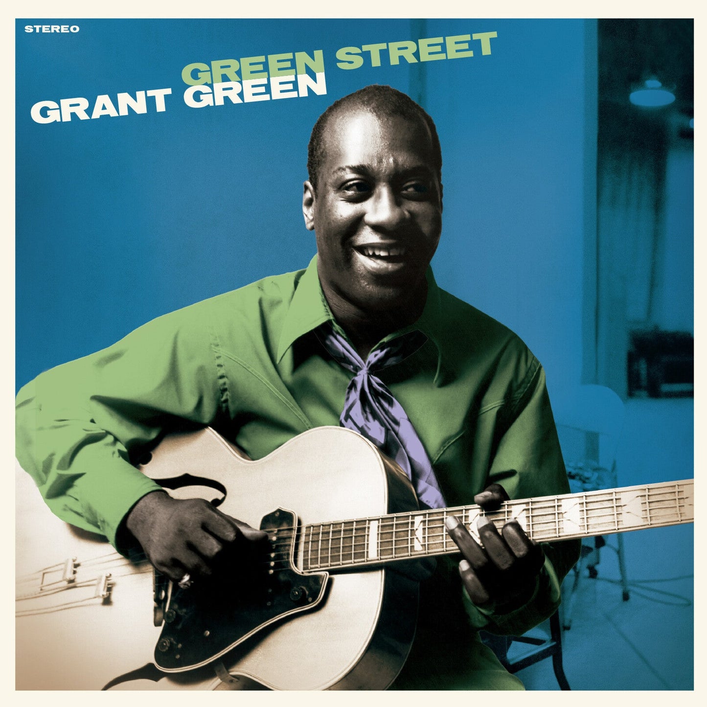 Grant Green album cover: portrait of a smiling guitarist with a guitar.
