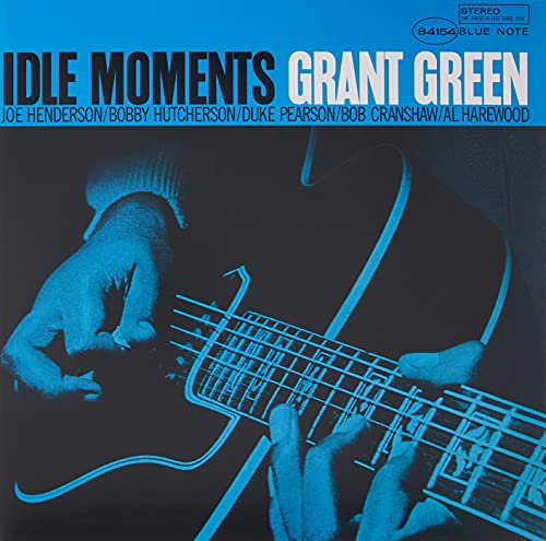 Blue-tinted vinyl cover showing a close-up of hands playing an electric guitar.