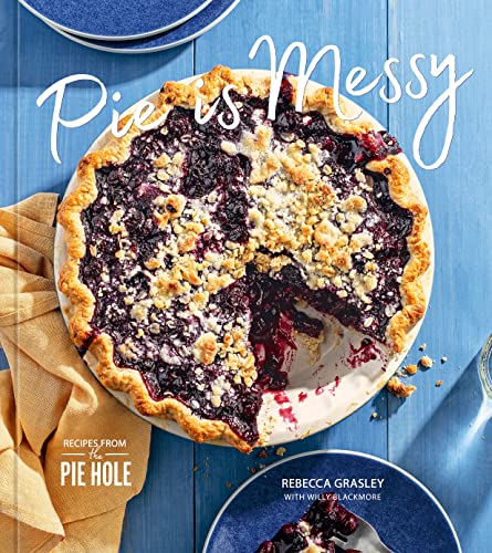 Book cover featuring a blueberry pie with a rustic, crumbly topping.