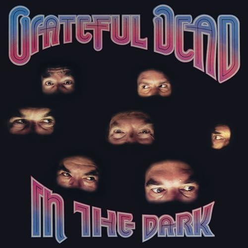 Grateful Dead album cover, "In the Dark," with multiple eyes and band name.