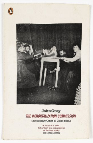 Book cover with black and white photo of people around a table.