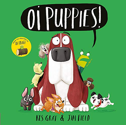 A large basset hound surrounded by various puppies and a frog on green background.