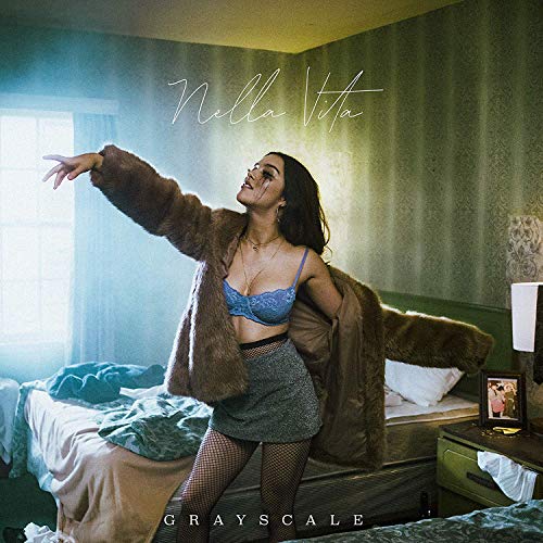 "Album cover featuring a woman in a bedroom, wearing a blue bra and fur coat."