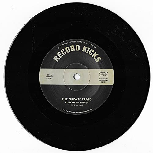 Black vinyl record label for The Grease Traps’ “Bird of Paradise.”