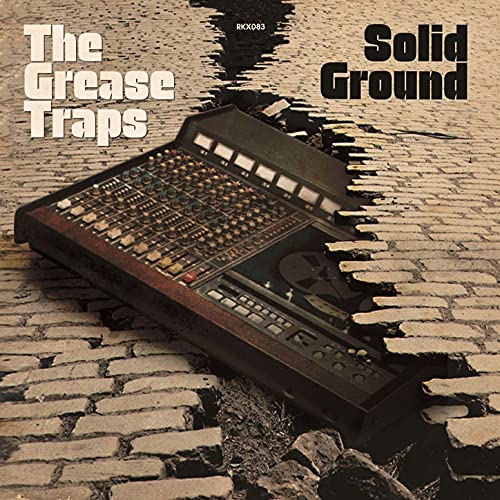 CD cover for "Grease Traps - Solid Ground" featuring a mixing console.