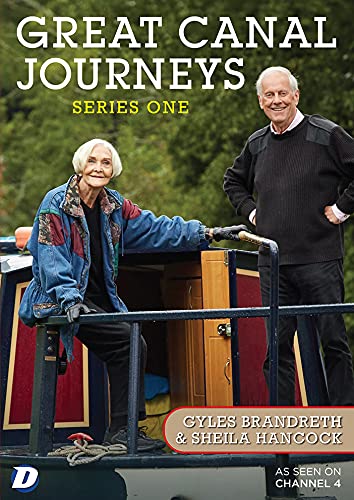 Sheila Hancock and Gyles Brandreth stand on a canal boat for Great Canal Journeys.