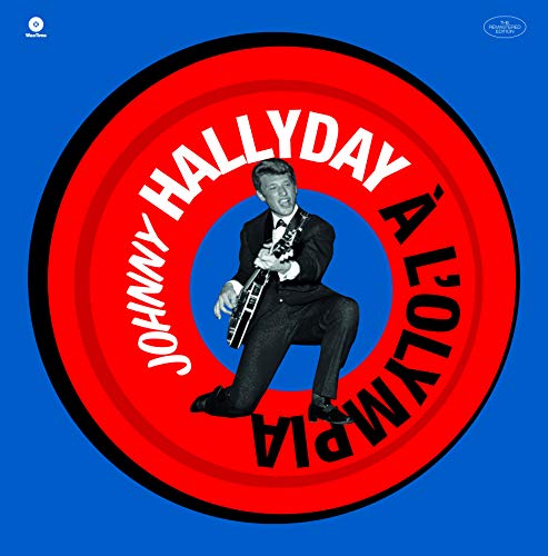 Johnny Hallyday playing guitar inside a red and black target on blue background.