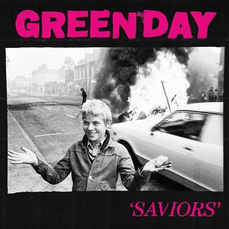 Green Day’s “Saviors” CD cover: boy in front of burning car.