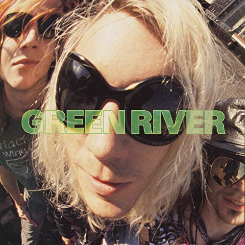 Close-up of a person wearing sunglasses, with "Green River" text overlay.