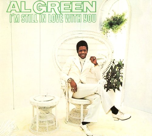 Album cover featuring Al Green sitting in a white wicker chair, wearing a white suit.