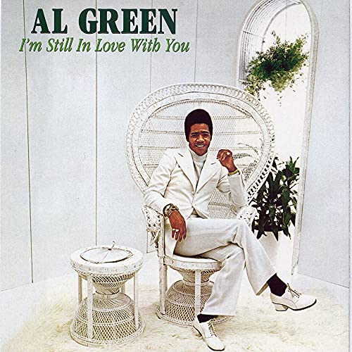 Al Green album cover: man in white suit seated in a wicker chair.