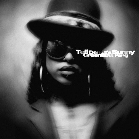 Black and white portrait of Greentea Peng wearing a hat and sunglasses.