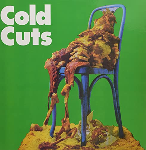 Album cover: meat draped over a blue chair on green background.